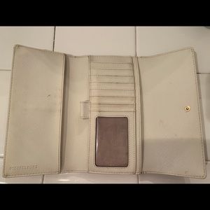 Cream Micheal Kors wallet and check book holder.